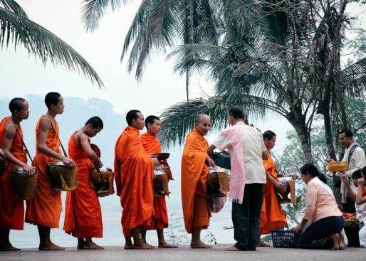 alms giving ceremony that takes places on the streets of Luang Prabang